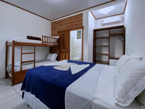 Ein Bett oder Betten in einem Zimmer der Unterkunft Pousada Alterosa