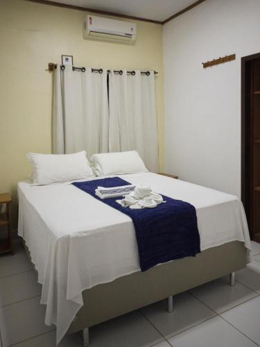 Ein Bett oder Betten in einem Zimmer der Unterkunft Pousada Alterosa