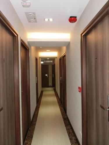 a corridor of a hotel with a long hallway at Hygge House in Hong Kong