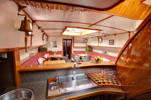 an interior view of a kitchen and living room in an rv at Panta Rhei Boatique Hotel in Amsterdam