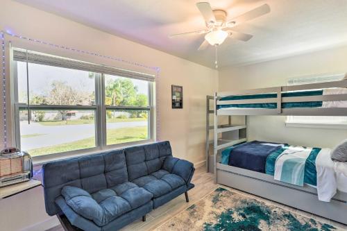 a living room with a couch and a bunk bed at Merritt Island Getaway - 8 Mi to Cocoa Beach! in Merritt Island