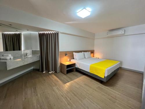 Ένα ή περισσότερα κρεβάτια σε δωμάτιο στο San Marino Suite Hotel
