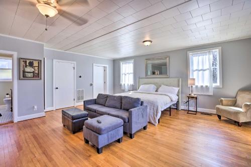 a bedroom with a bed and a couch and chairs at Birmingham Vacation Rental 9 Miles to Downtown! in Birmingham