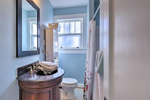 a bathroom with a sink and a toilet and a mirror at Birmingham Vacation Rental 9 Miles to Downtown! in Birmingham