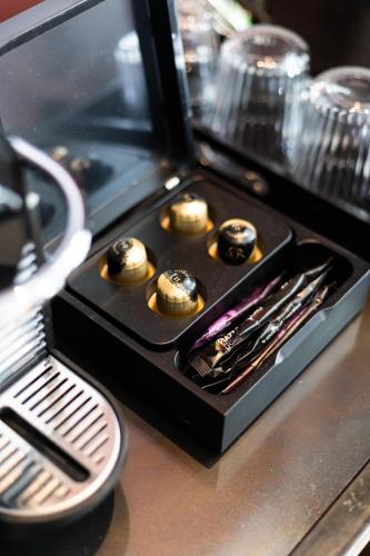 a counter with a tray of muffins in a case at Weber Hotel 397 in Amsterdam