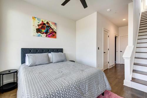 a bedroom with a bed and a painting on the wall at Modern ATL Getaway Less Than 3 Mi to Mercedes-Benz Stadium in Atlanta
