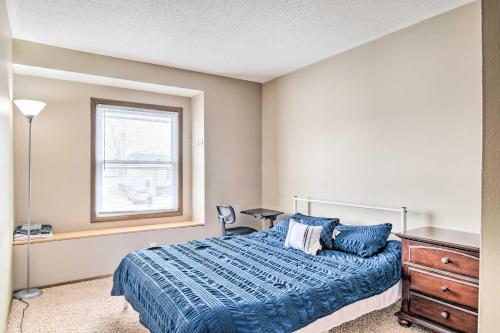 um quarto com uma cama, uma janela e uma cómoda em Cedar Rapids Rental with Yard about 6 Mi to Downtown! em Cedar Rapids