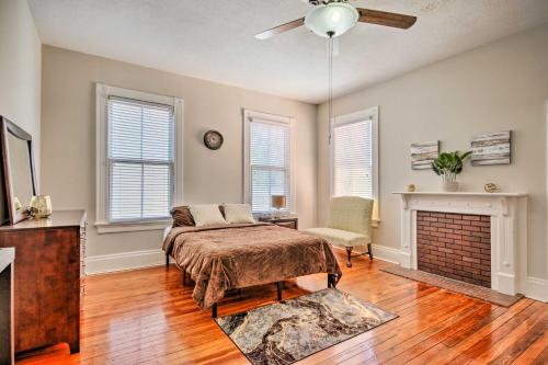 a bedroom with a bed and a fireplace at Airy Vacation Rental in Augusta, Georgia! in Augusta