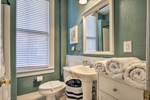 a bathroom with a sink and a toilet and a mirror at Airy Vacation Rental in Augusta, Georgia! in Augusta