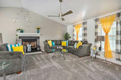 a living room with two couches and a fireplace at Richmond Home with Pool, 5 Mi to Downtown! in Richmond
