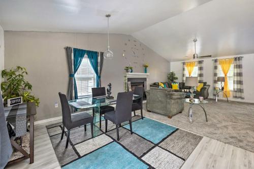 a living room with a table and a couch at Richmond Home with Pool, 5 Mi to Downtown! in Richmond