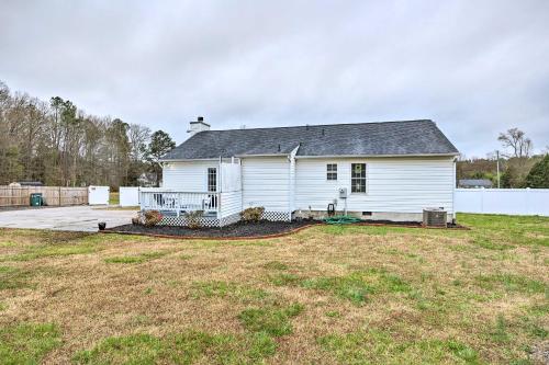 a white house with a large yard in front of it at Richmond Home with Pool, 5 Mi to Downtown! in Richmond