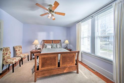 a bedroom with a bed and a ceiling fan at Edenton Vacation Rental with Patio Walk Downtown in Edenton