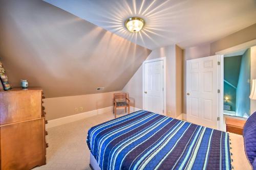 a bedroom with a bed and a table and a chair at Edenton Vacation Rental with Patio Walk Downtown in Edenton