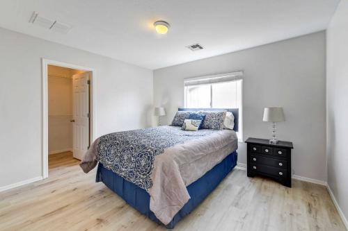 a bedroom with a king sized bed and a window at Putting Green, Pool and Spa Home in Queen Creek! in Queen Creek