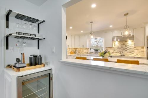 a kitchen with white cabinets and a counter top at Lovely Highland Home with Pool and Hot Tub! in Highland