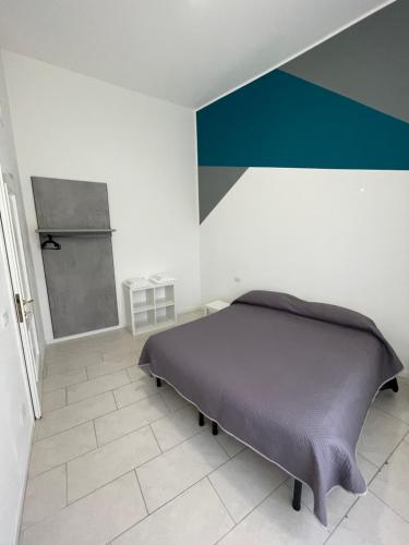 Ένα ή περισσότερα κρεβάτια σε δωμάτιο στο PAHome - Trilocale Piazza Fontana Grande LT