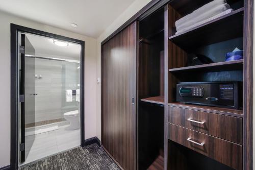 a bathroom with a toilet and a microwave at Venezia in Miami Beach