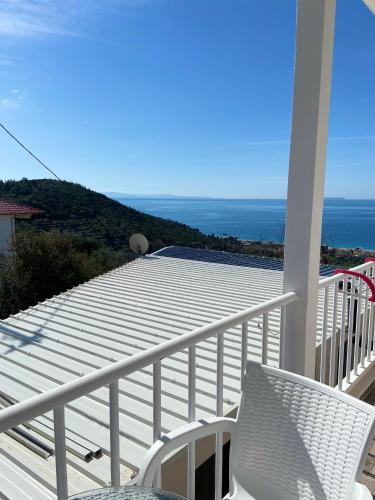 a balcony with a view of the ocean at Persephone in Himare