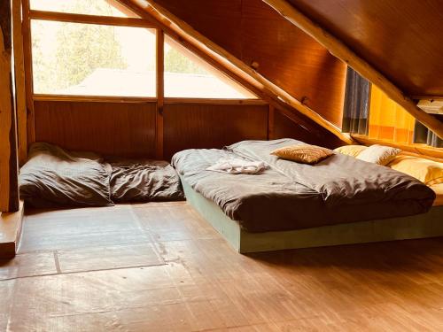 a bedroom with two beds in a attic at The Villster Resort in Kasol