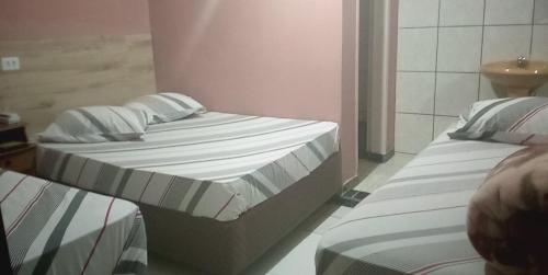 Una cama o camas en una habitación de Hotel Faf's Interlagos - SP
