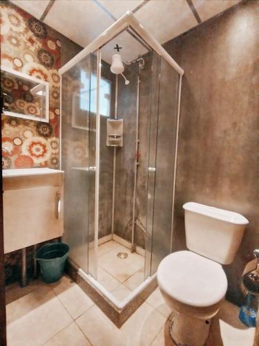 a bathroom with a shower and a toilet in it at Albergue Cultural Hostel in Rio de Janeiro