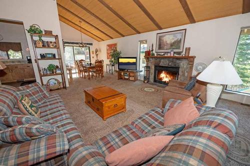 a living room with a couch and a fireplace at 3407 Pine Hill Home in South Lake Tahoe