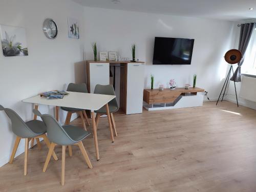 TV a/nebo společenská místnost v ubytování Kutscherhaus