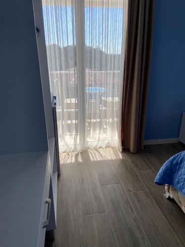 a bedroom with a large window with a view at Persephone in Himare