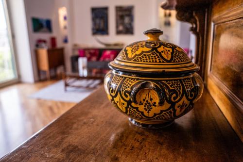 a vase sitting on top of a wooden table at Casa Sofia Apt in Naples