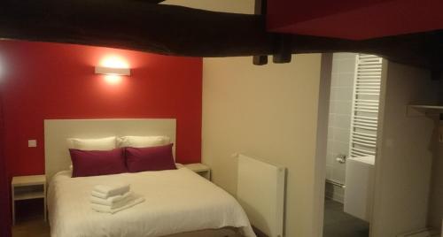 Ένα ή περισσότερα κρεβάτια σε δωμάτιο στο Hôtel Carpe Diem
