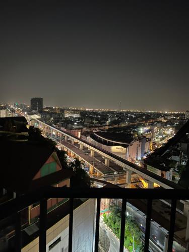 a view of a city at night with a train station at Mall Suites Hotel in Bangkok