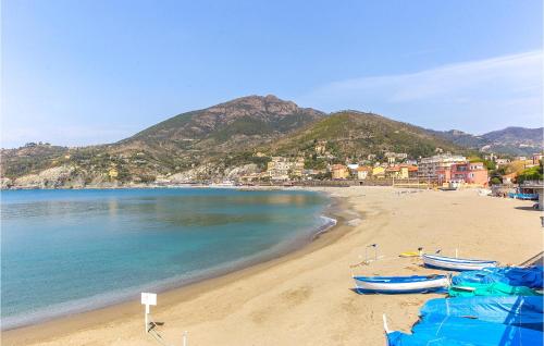 a beach with two boats sitting on the sand at 2 Bedroom Gorgeous Home In Bonassola in Bonassola