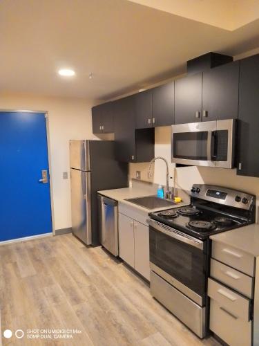 a kitchen with a stove and a refrigerator at Private Room North Portland in Portland