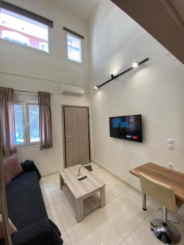 Televízia a/alebo spoločenská miestnosť v ubytovaní Luxury Loft Kalu Tsesme A