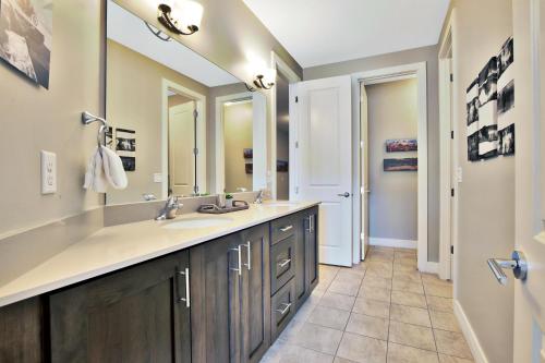 a bathroom with a sink and two mirrors at Entrada at Moab 624 and 632 in Moab