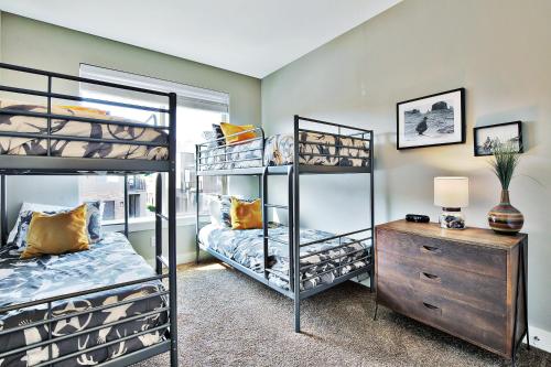 a bedroom with two bunk beds and a dresser at Entrada at Moab 624 and 632 in Moab
