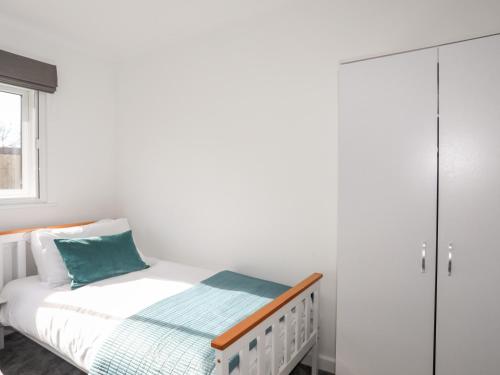 Postel nebo postele na pokoji v ubytování Ger Y Llan