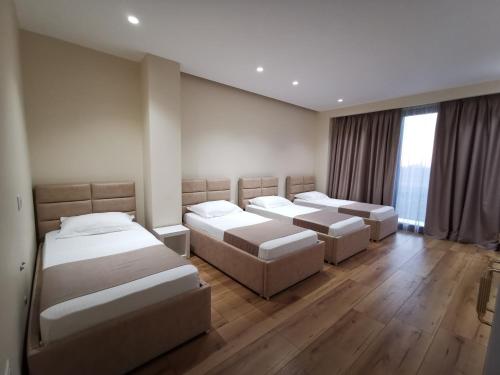 Postel nebo postele na pokoji v ubytování Te Aldo Hotel
