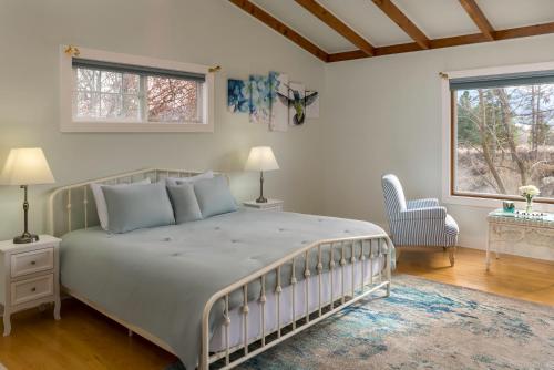a bedroom with a large bed and a window at Gardenview Estate Bed and Breakfast in Kettle Falls