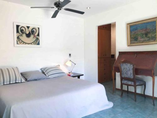 Säng eller sängar i ett rum på Relaxation Oasis in Chacras de Coria