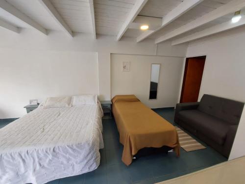 Ένα ή περισσότερα κρεβάτια σε δωμάτιο στο Vidorra Calafate