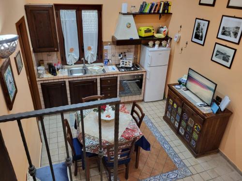 an overhead view of a kitchen with a table and a television at Scorcio Di Mare in Agrigento