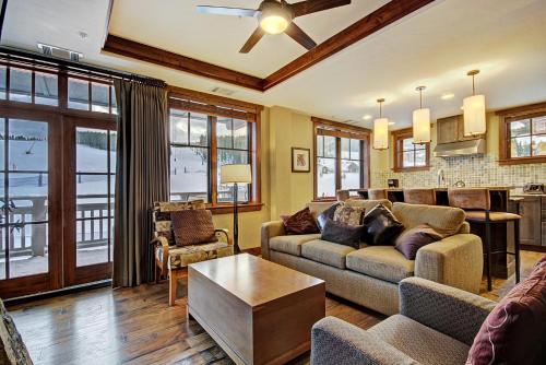 a living room with a couch and a table at One Ski Hill Place S8309 in Breckenridge