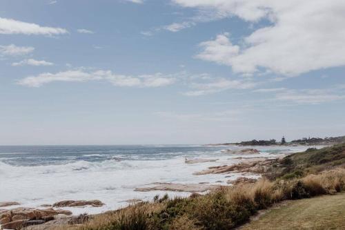 a view of the ocean from a beach at OceanFront - Absolute Waterfront in Bicheno