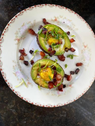 a plate of food with avocado and bacon at Almondy Inn Bed & Breakfast in Newport