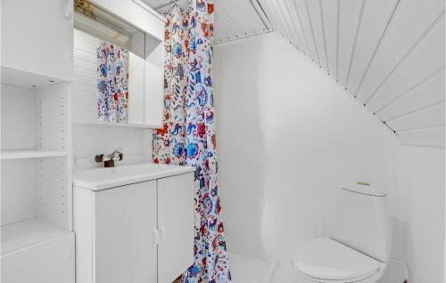 a bathroom with a sink and a shower curtain at Beautiful Apartment In Hirtshals With Kitchen in Hirtshals