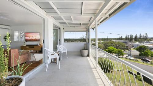 a balcony with a view of a city at Malolo in Yamba
