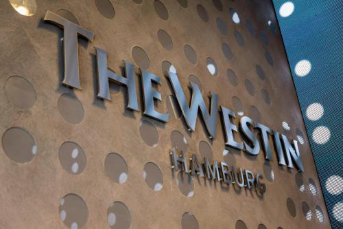 a sign for the entrance to the hiltonnesota building at The Westin Hamburg in Hamburg