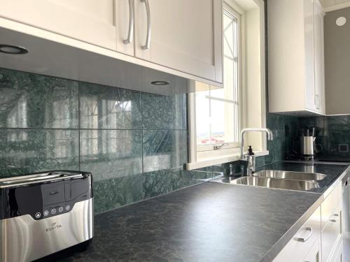 a kitchen with a sink and a counter top at 8 person holiday home in UDDEVALLA-By Traum in Sundsandvik